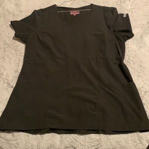 Black women’s scrub shirt, size 2X the brand is Med Couture 4-Ever Flex.
